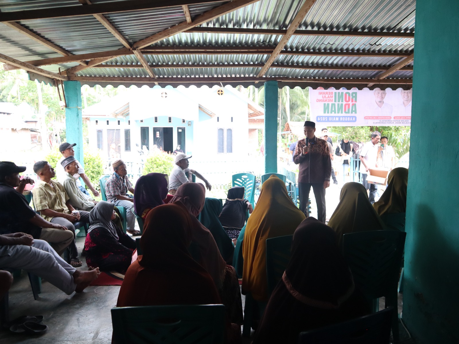Keterangan Foto : Adnan Entengo lakukan kampanye di Dusun Toluludu, Desa Botumoputi, Kecamatan Tibawa./Sumber : (Media Center)